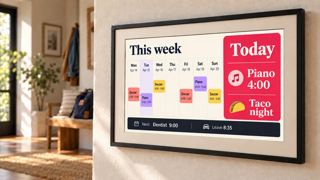 A photo frame on a wall showing the Family calendar page